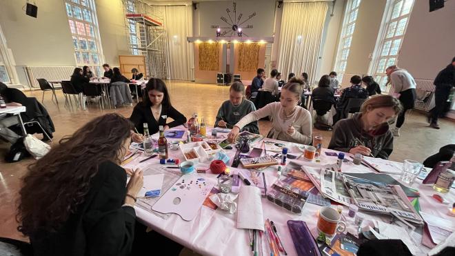 Photo shows students at the craft table.