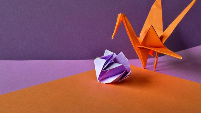 Paper crane and a crumpled leaf.