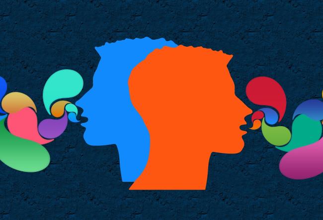 2 heads, one blue and one red, in the center of the picture. Bubbles fly out of their mouths, which is a metaphor for speech.
