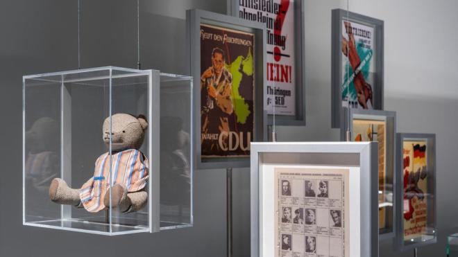 View of the permanent exhibition featuring historical artifacts and political posters